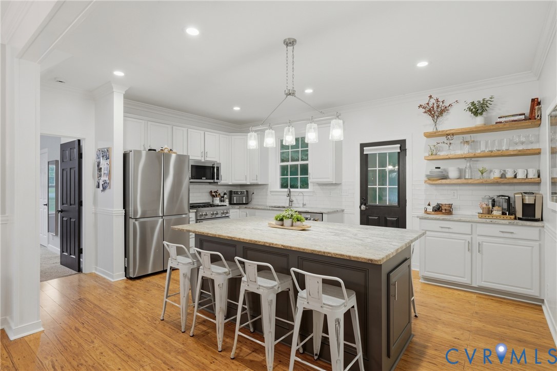 1755 Dispatch Road Quinton, VA 23141 - Photo 12 of 35 Kitchen featuring wood-finish flooring, a central