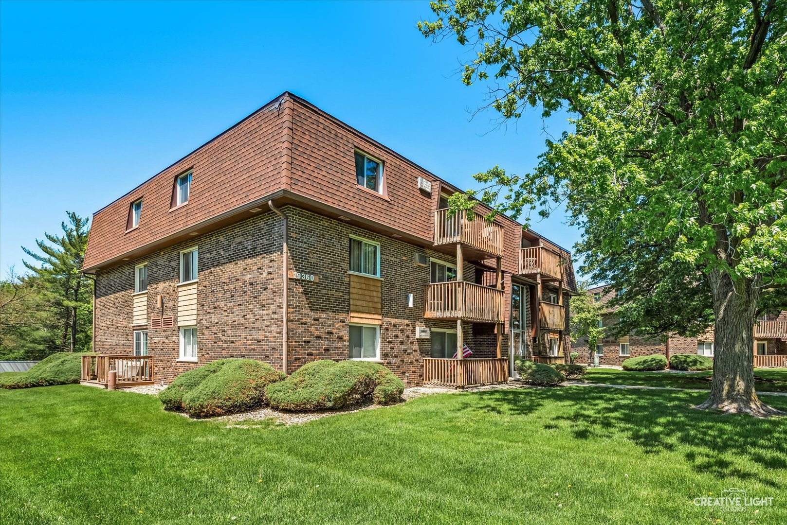 19360 Wolf Road, Unit 9 Mokena, IL 60448 - Photo 12 of 16 a front view of a house with a yard
