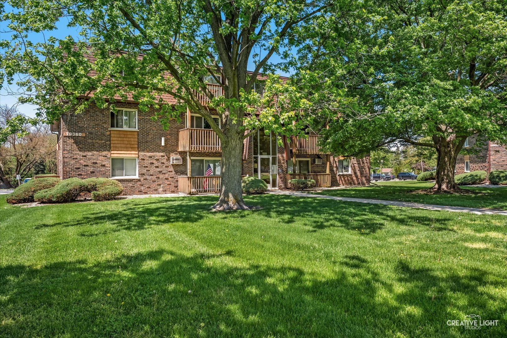 19360 Wolf Road, Unit 9 Mokena, IL 60448 - Photo 13 of 16 a view of a house with yard and tree s