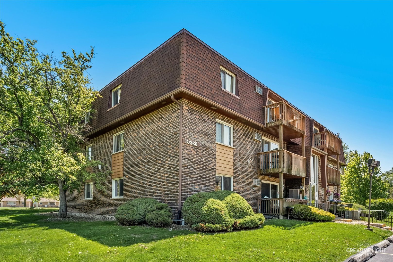 19360 Wolf Road, Unit 9 Mokena, IL 60448 - Photo 14 of 16 a front view of a house with a yard