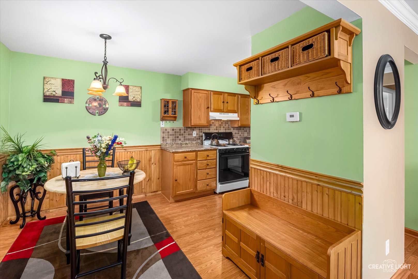 19360 Wolf Road, Unit 9 Mokena, IL 60448 - Photo 6 of 16 a kitchen with stainless steel appliances granite countertop a stove and a dining table