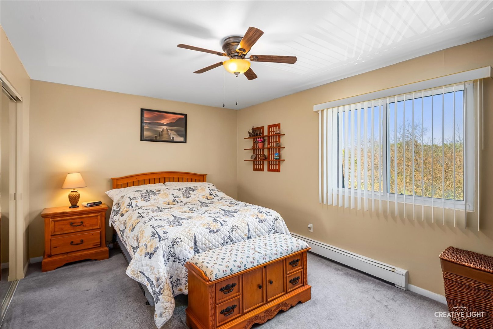 19360 Wolf Road, Unit 9 Mokena, IL 60448 - Photo 7 of 16 a bedroom with a bed and a chandelier