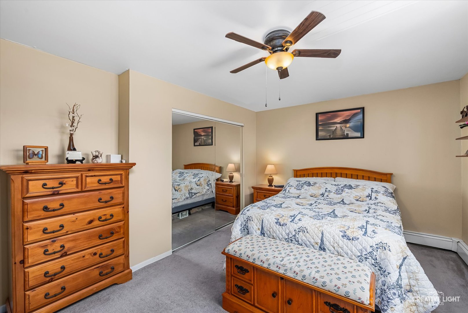19360 Wolf Road, Unit 9 Mokena, IL 60448 - Photo 8 of 16 a bedroom with a bed and a dresser in it