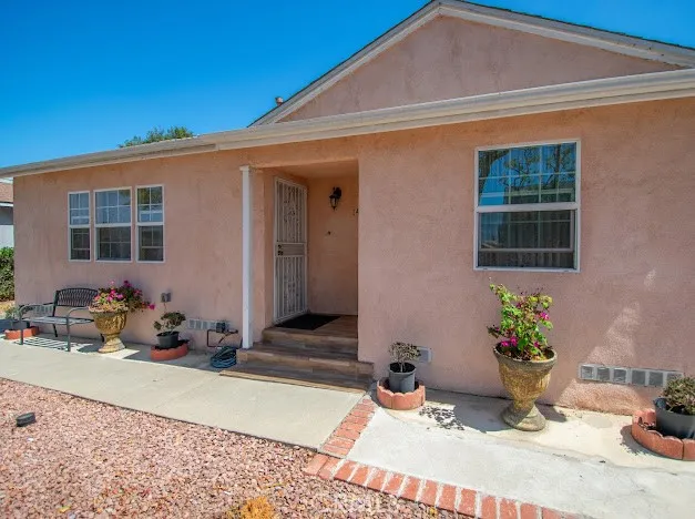 a backyard of a house with seating space
