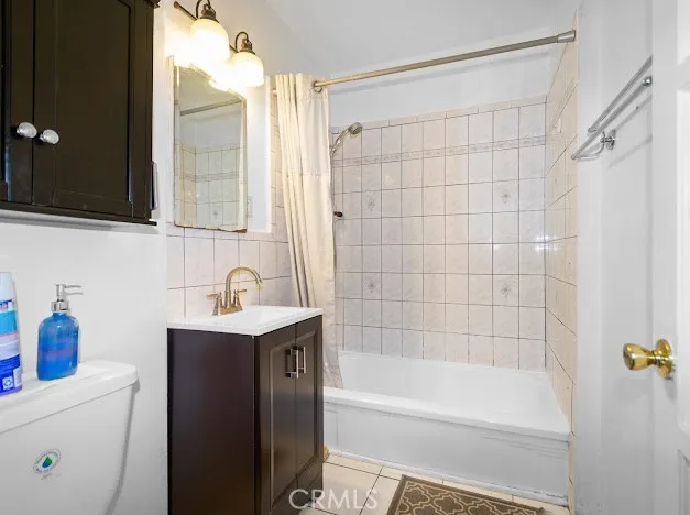 a bathroom with a bathtub a sink a vanity and a shower