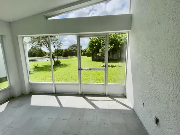 a view of a porch with a floor to ceiling window