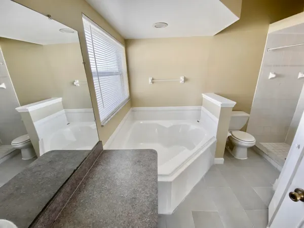 a bathroom with a sink a toilet and a bathtub