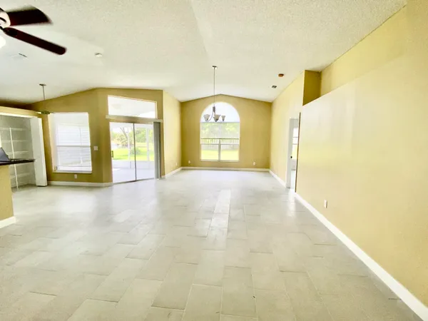 a view of an empty room with a fireplace