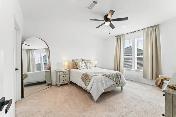 a bed room with a bed and a window