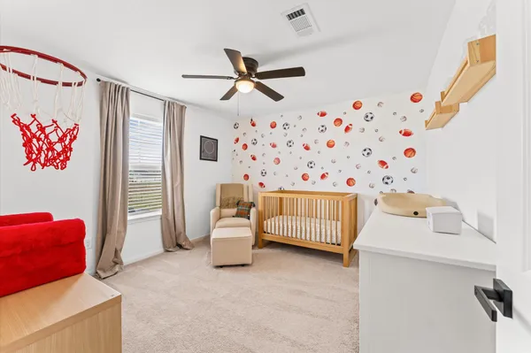 a bedroom with furniture and a window