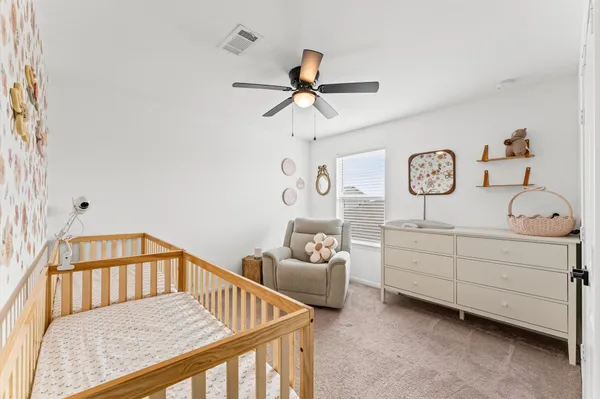 a bedroom with furniture and a window