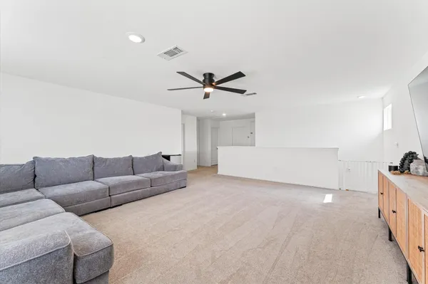 a living room with furniture and window