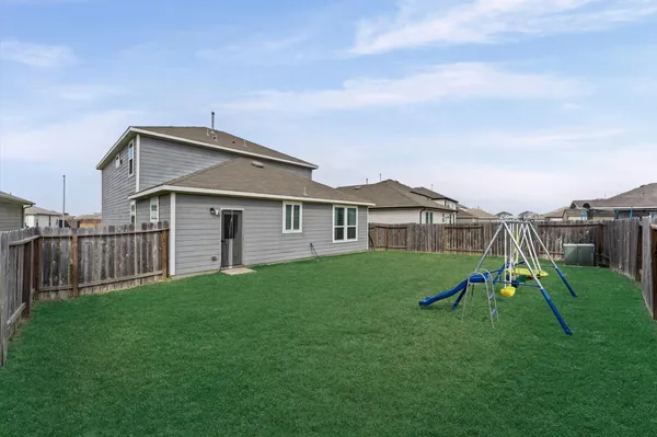 a view of backyard of the house