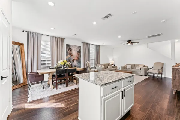 a view of kitchen island with granite countertop dining room