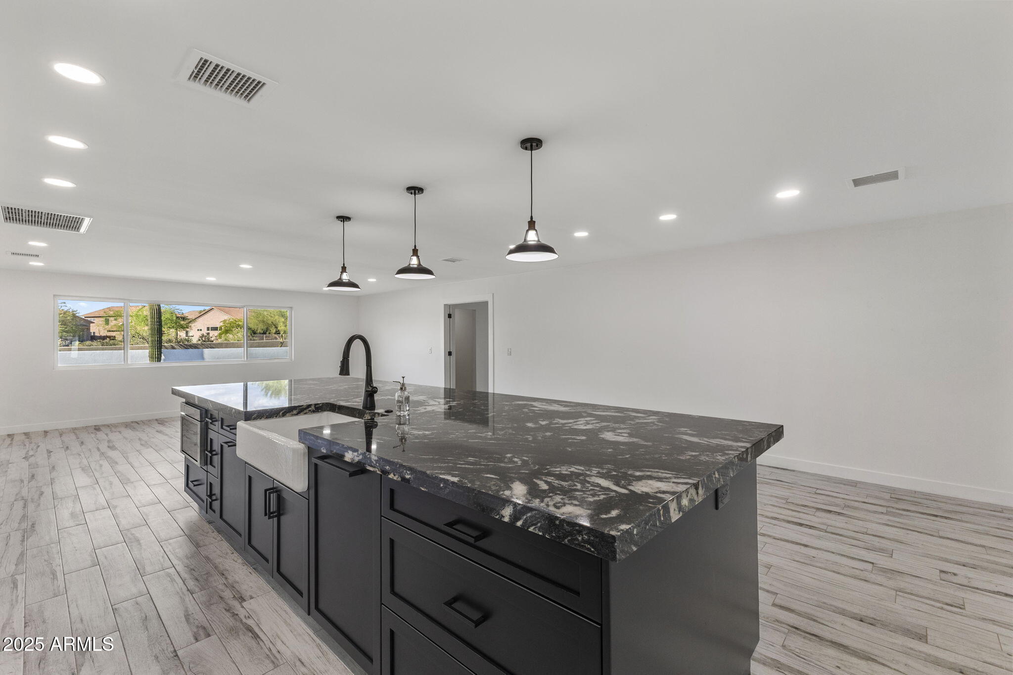 5219 East Lone Mountain Road Cave Creek, AZ 85331 - Photo 16 of 88 a kitchen with stainless steel appliances granite countertop a stove and a wooden floors