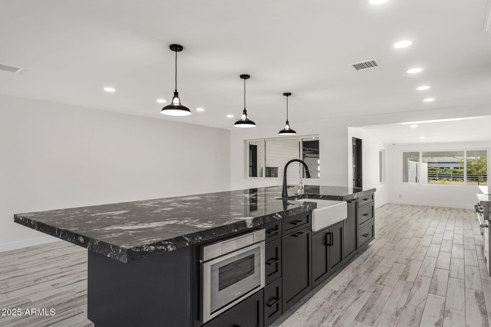 5219 East Lone Mountain Road Cave Creek, AZ 85331 - Photo 20 of 88 a kitchen with stainless steel appliances granite countertop a stove and a sink