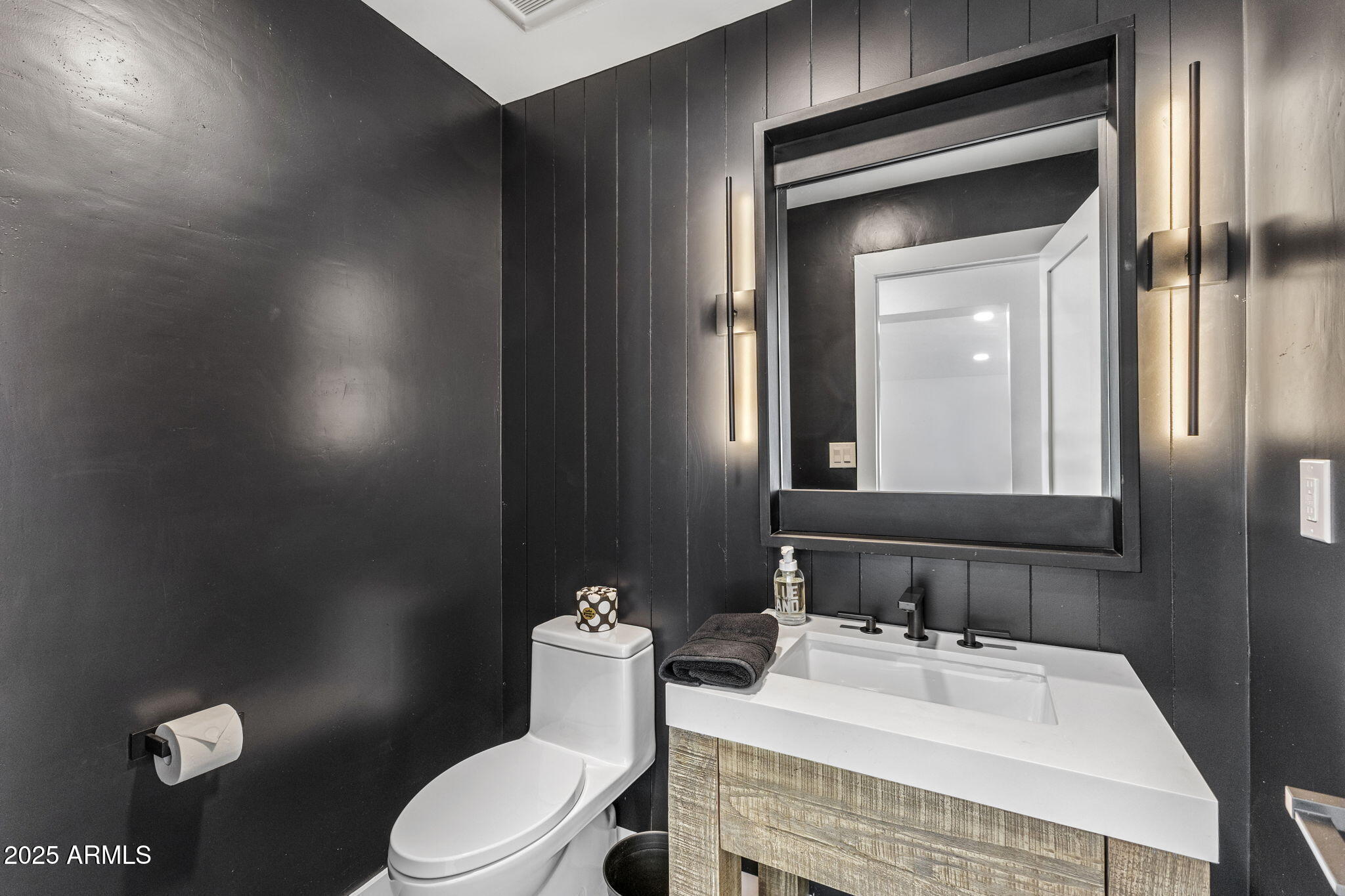5219 East Lone Mountain Road Cave Creek, AZ 85331 - Photo 29 of 88 a bathroom with a sink toilet and mirror