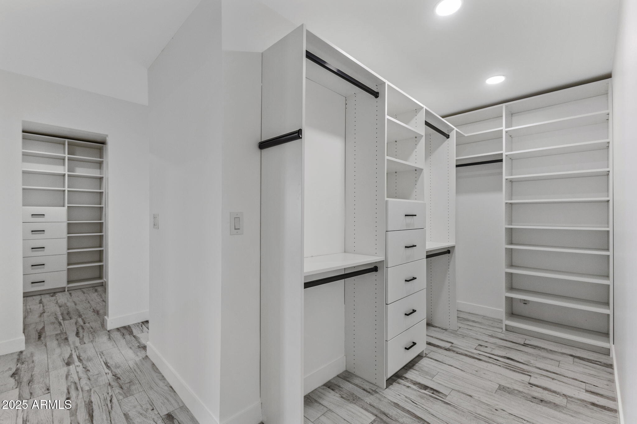 5219 East Lone Mountain Road Cave Creek, AZ 85331 - Photo 39 of 88 a view of walk in closet with empty racks