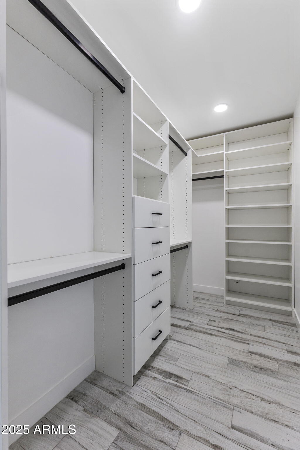 5219 East Lone Mountain Road Cave Creek, AZ 85331 - Photo 40 of 88 a view of walk in closet with empty racks
