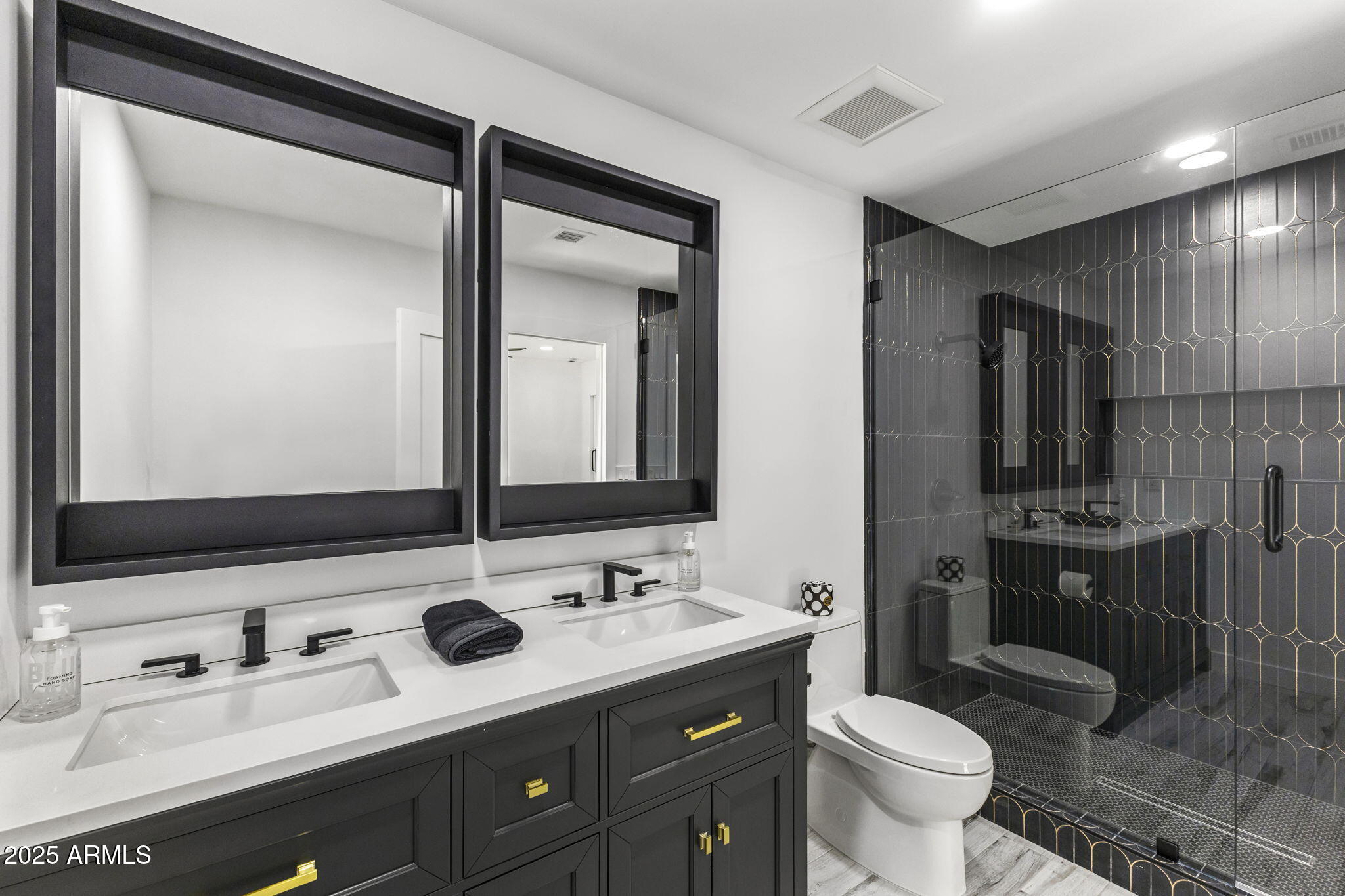 5219 East Lone Mountain Road Cave Creek, AZ 85331 - Photo 44 of 88 a bathroom with a double vanity sink toilet and mirror