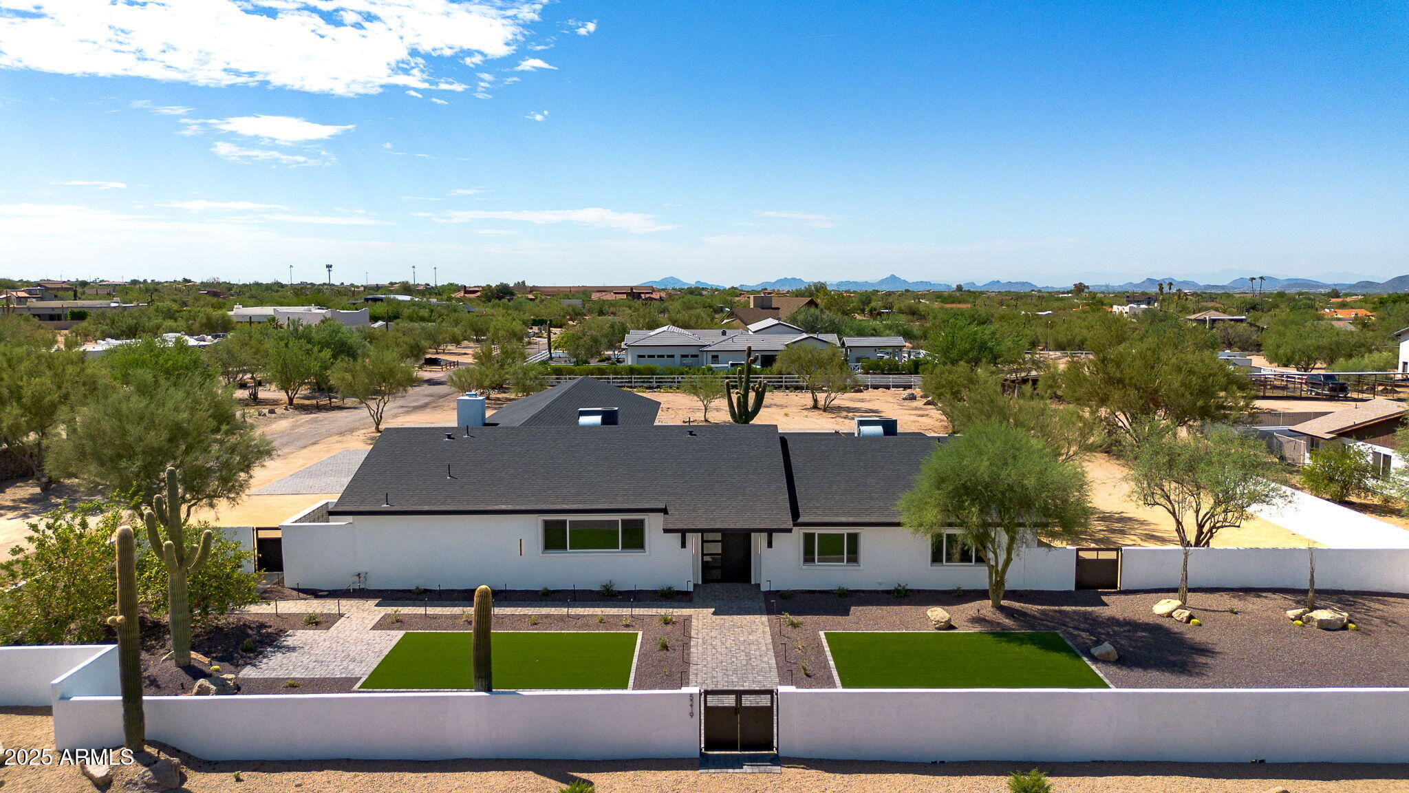 5219 East Lone Mountain Road Cave Creek, AZ 85331 - Photo 69 of 88 an aerial view of a house with a garden