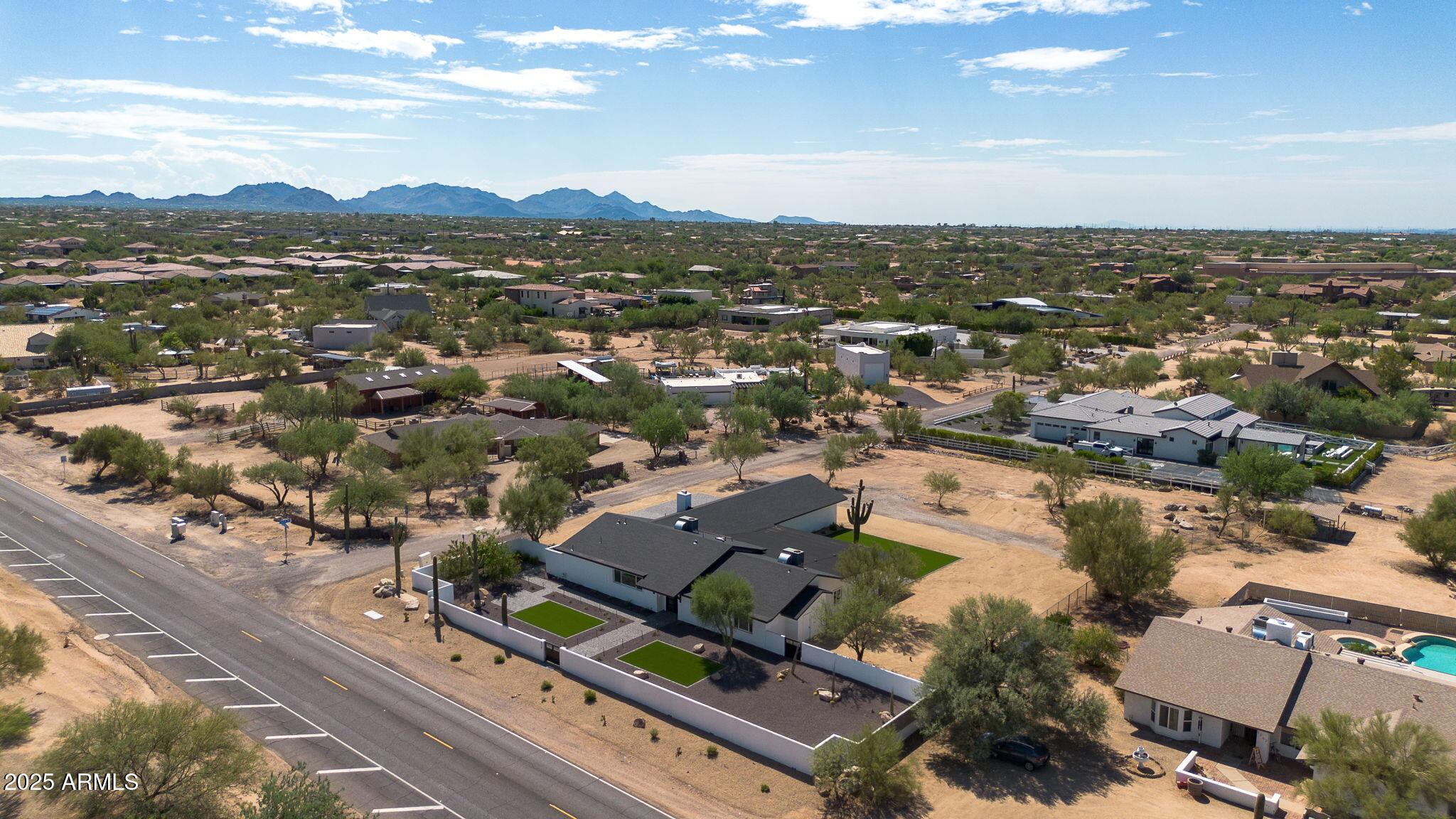5219 East Lone Mountain Road Cave Creek, AZ 85331 - Photo 84 of 88 an aerial view of residential houses with outdoor space and river