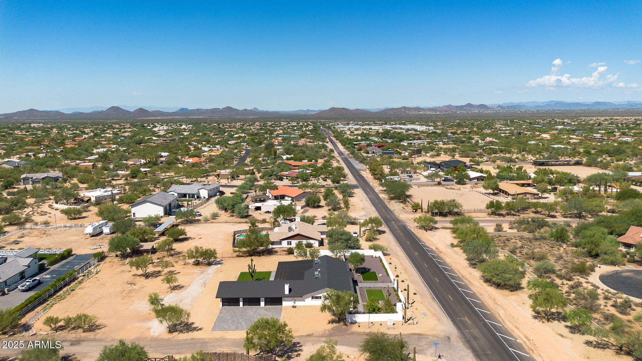 5219 East Lone Mountain Road Cave Creek, AZ 85331 - Photo 86 of 88 an aerial view of residential houses with outdoor space