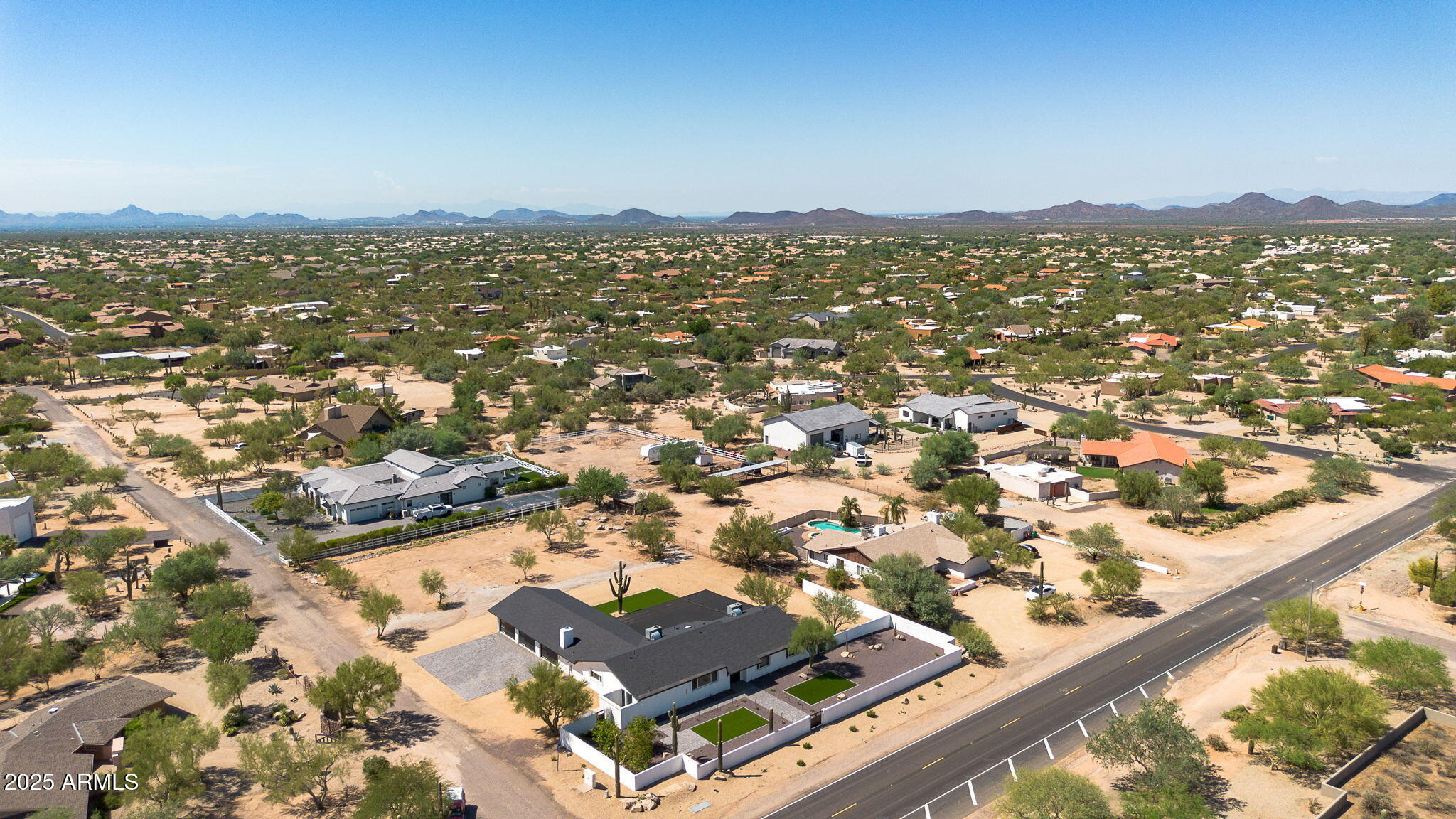 5219 East Lone Mountain Road Cave Creek, AZ 85331 - Photo 88 of 88 an aerial view of residential houses with outdoor space