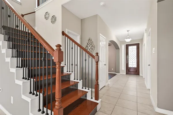 a view of a hallway with staircase