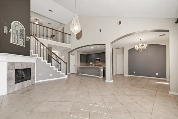 a large kitchen with stainless steel appliances granite countertop a sink and cabinets