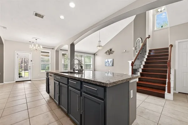 a kitchen with a table and chairs