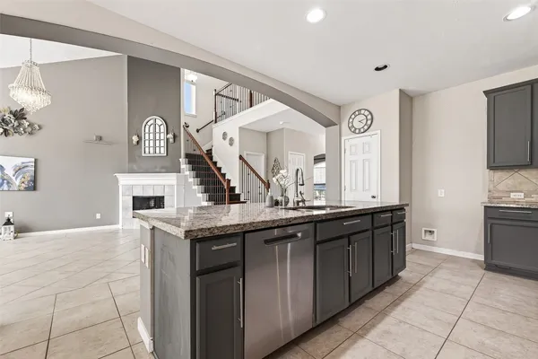 a view of living room with granite countertop furniture and fireplace
