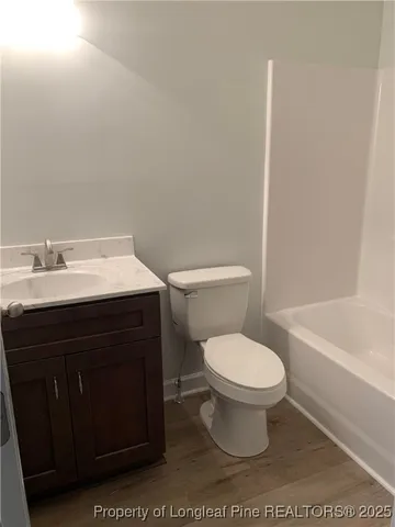 a bathroom with a sink toilet and a bathtub