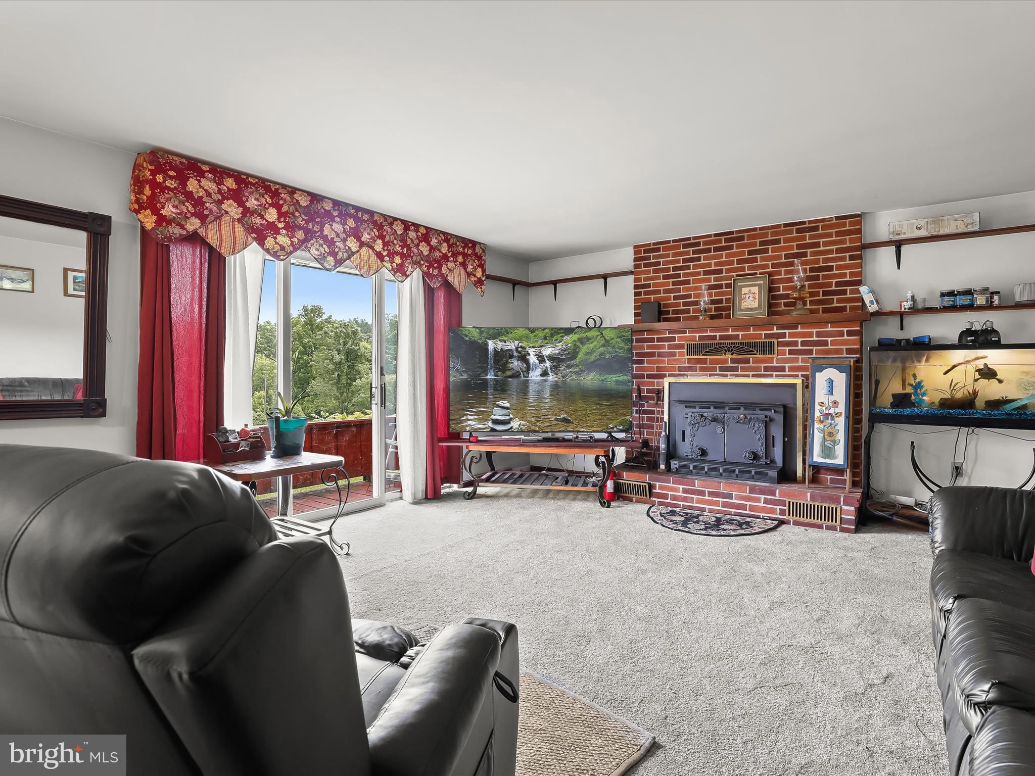 4704 Baughman Mill Road Manchester, MD 21102 - Photo 12 of 64 a living room with furniture and a fireplace