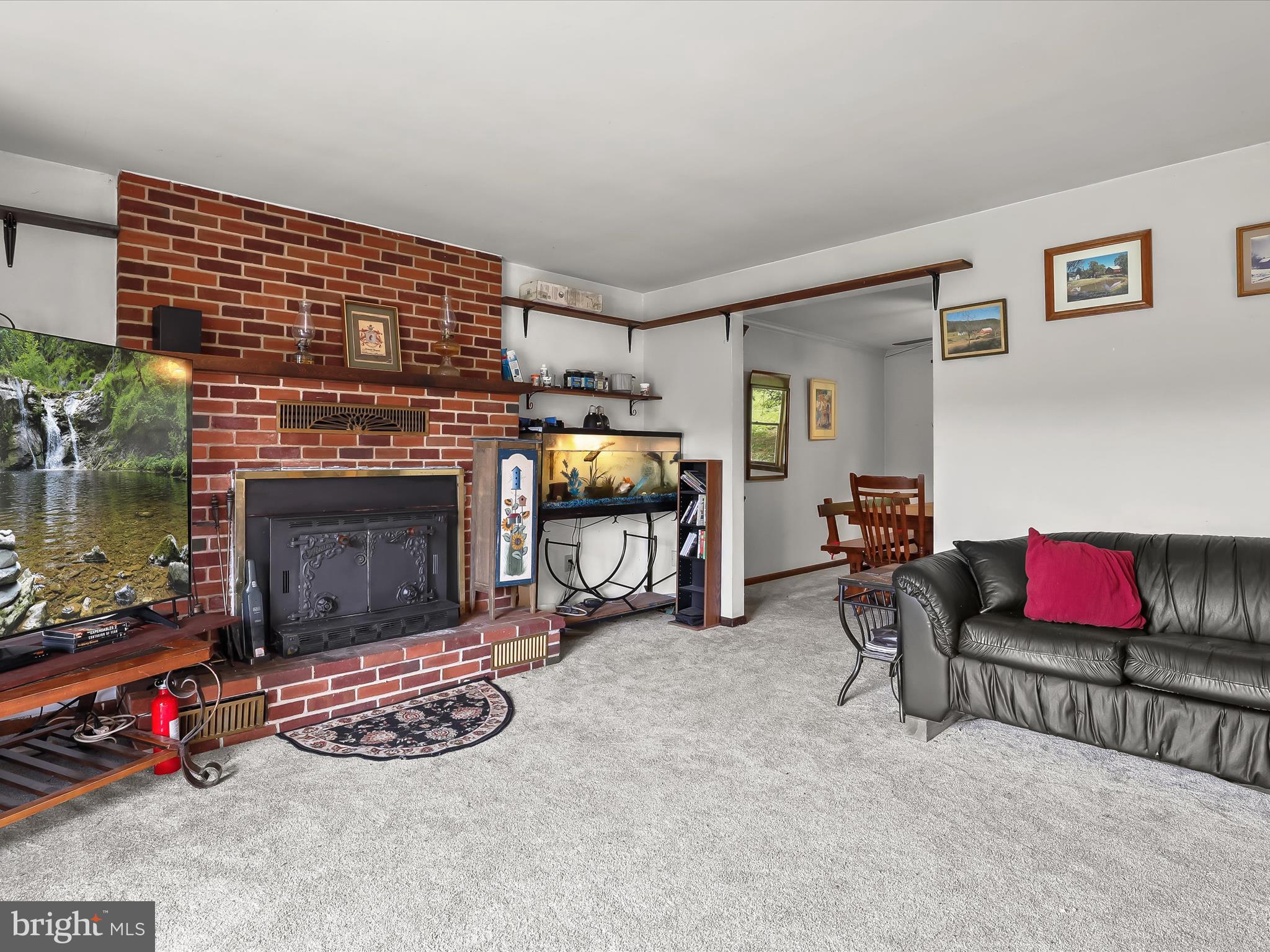 4704 Baughman Mill Road Manchester, MD 21102 - Photo 13 of 64 a living room with furniture and a fireplace