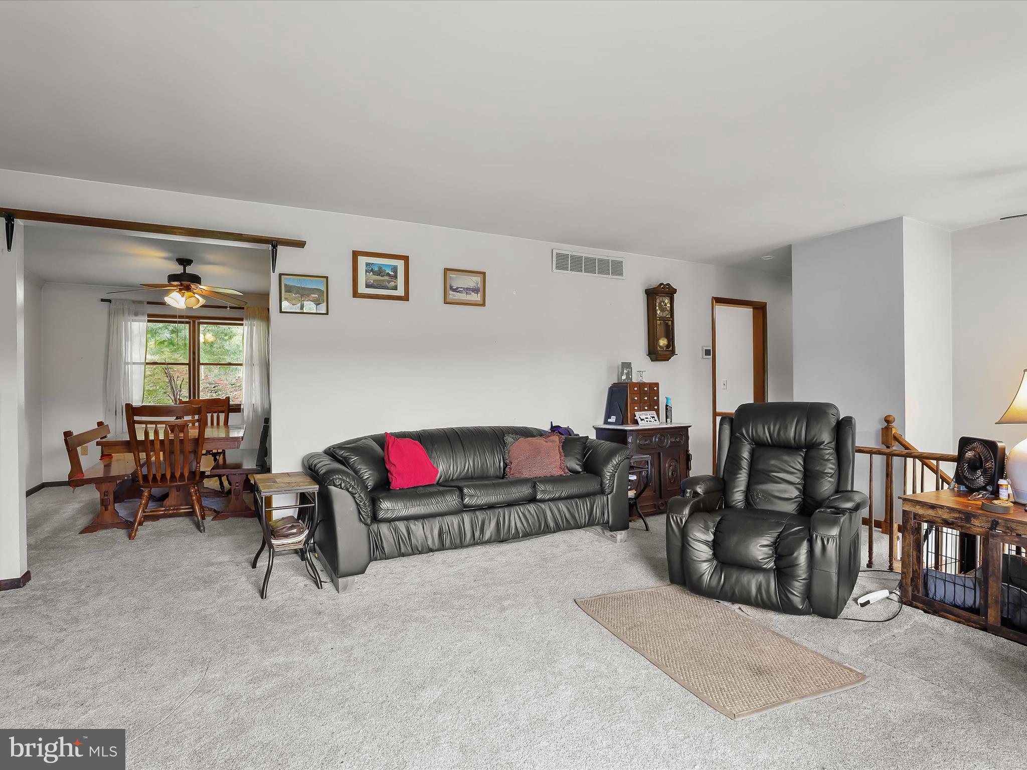 4704 Baughman Mill Road Manchester, MD 21102 - Photo 14 of 64 a living room with furniture and a flat screen tv