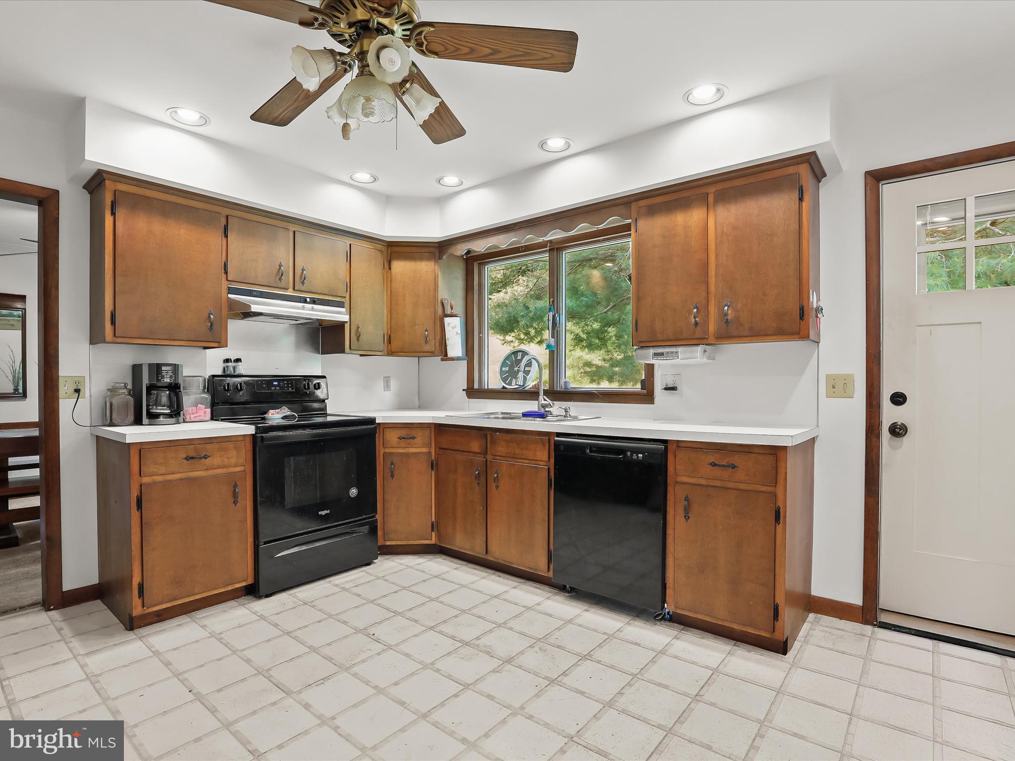 4704 Baughman Mill Road Manchester, MD 21102 - Photo 20 of 64 a kitchen with stainless steel appliances granite countertop a stove a sink and a refrigerator
