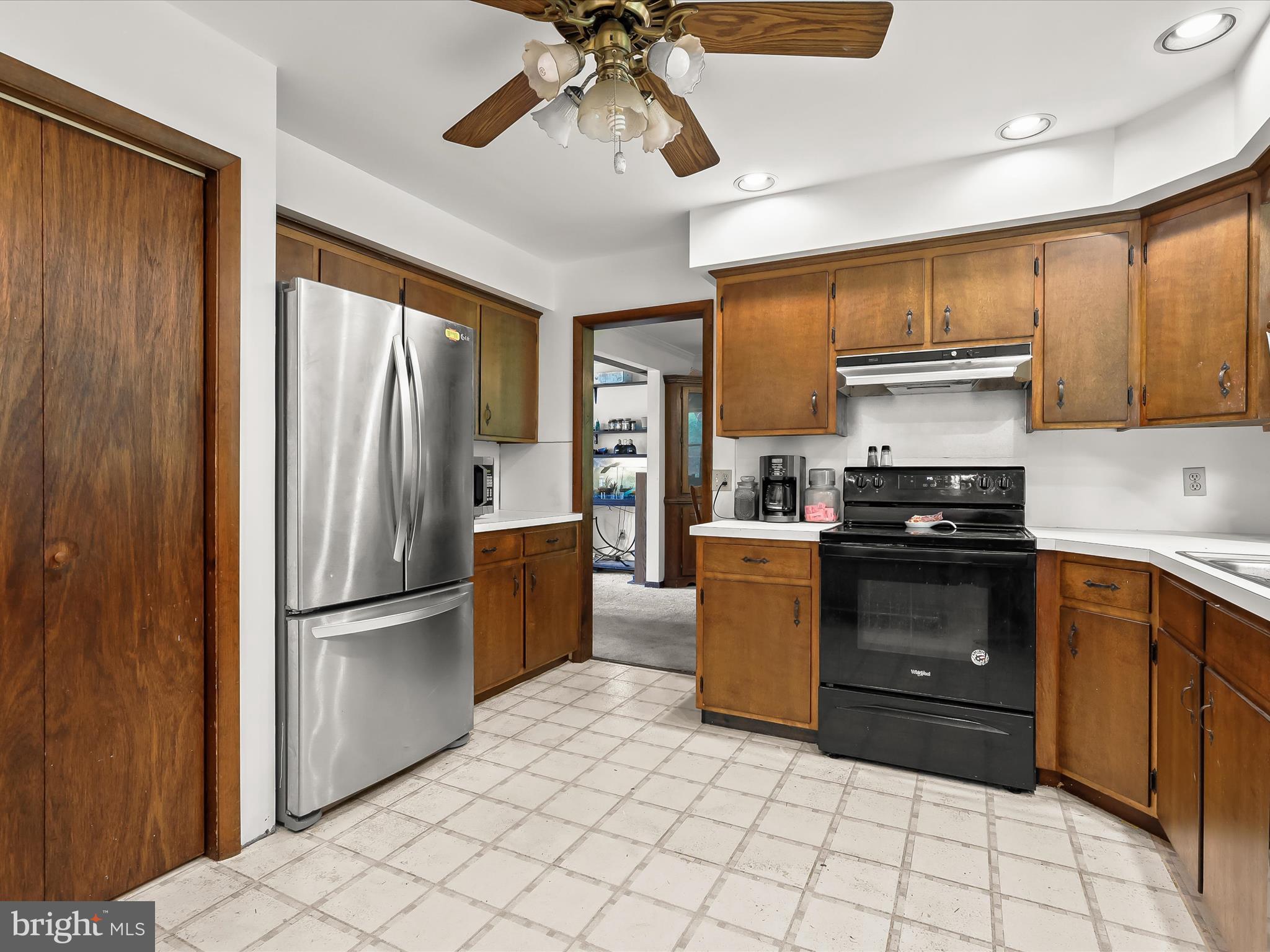 4704 Baughman Mill Road Manchester, MD 21102 - Photo 21 of 64 a kitchen with stainless steel appliances granite countertop a refrigerator a stove a sink and a microwave