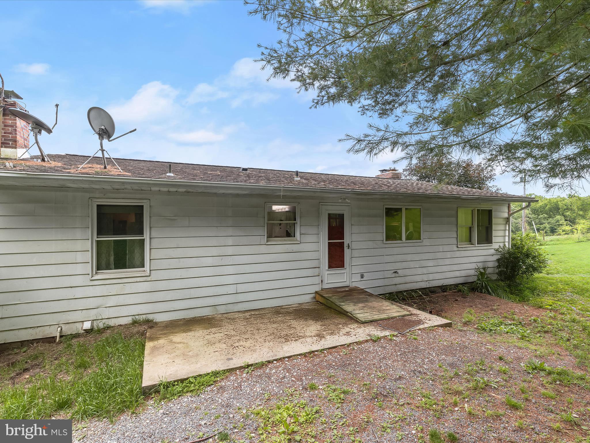 4704 Baughman Mill Road Manchester, MD 21102 - Photo 27 of 64 a view of a house with a backyard