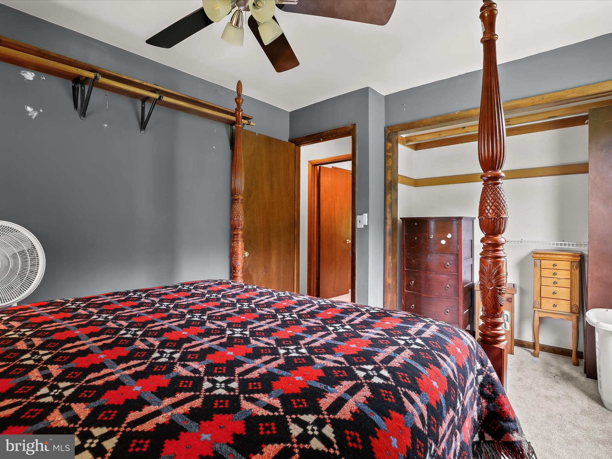 4704 Baughman Mill Road Manchester, MD 21102 - Photo 29 of 64 a bedroom with a bed and a chandelier