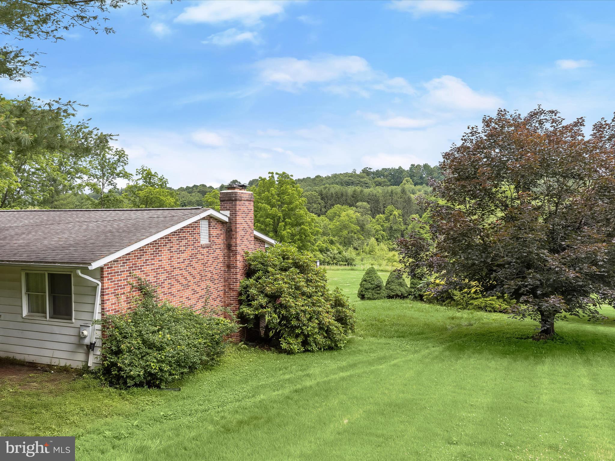 4704 Baughman Mill Road Manchester, MD 21102 - Photo 42 of 64 front view of a house with a garden