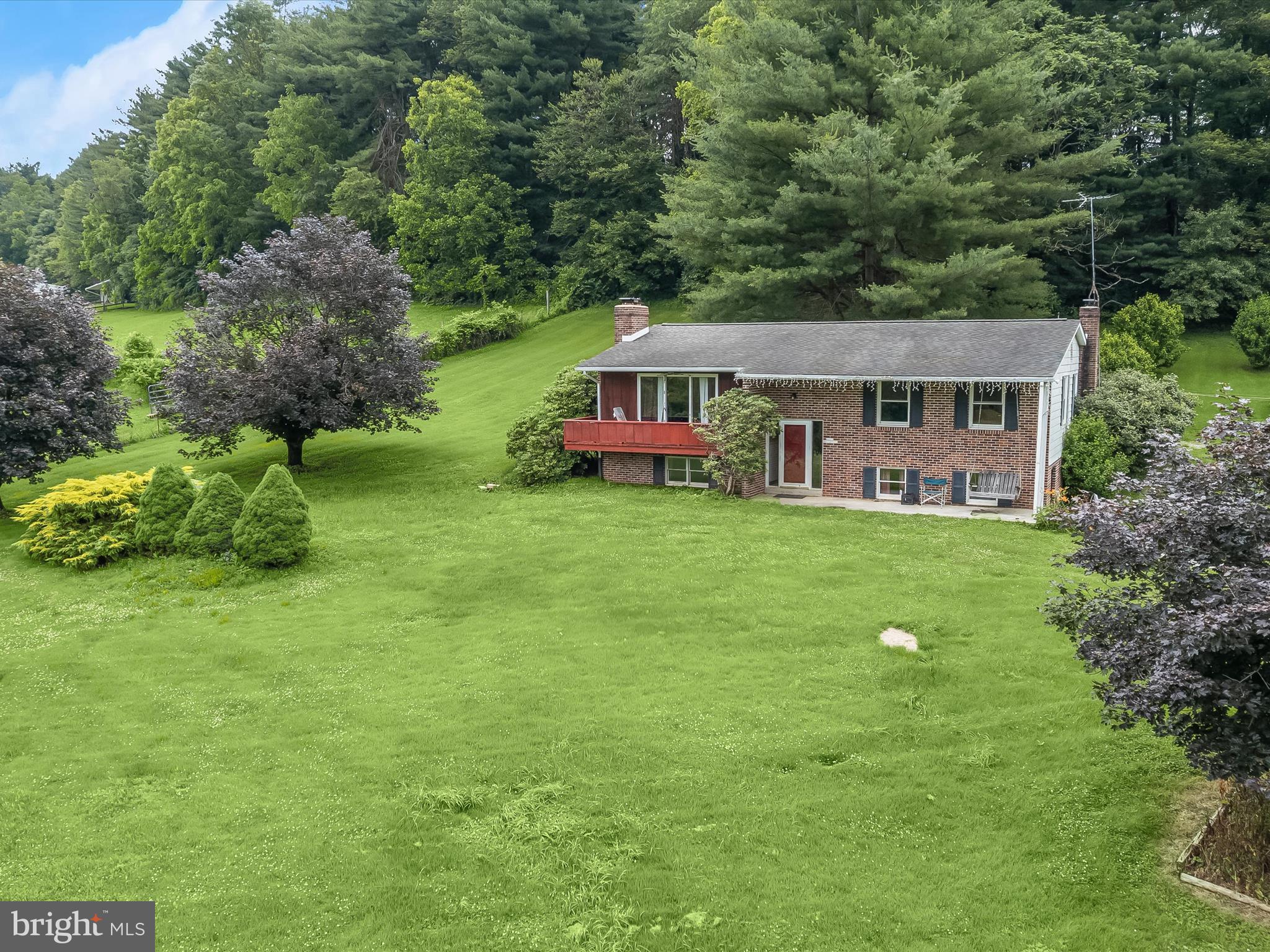 4704 Baughman Mill Road Manchester, MD 21102 - Photo 5 of 64 a front view of a house with garden