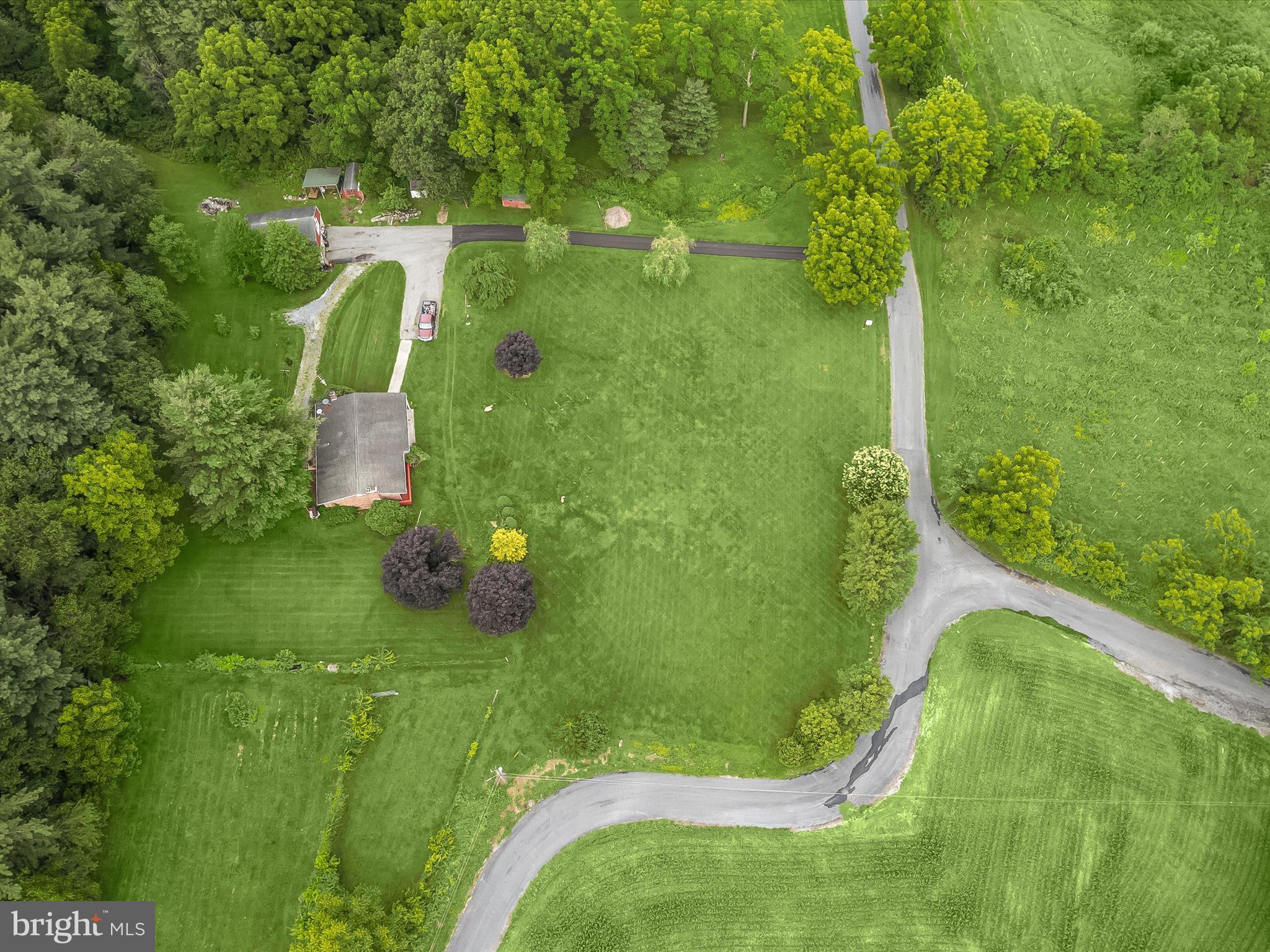 4704 Baughman Mill Road Manchester, MD 21102 - Photo 51 of 64 a green field with lots of tress in it