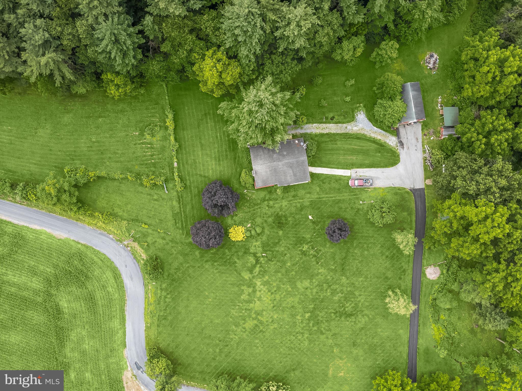 4704 Baughman Mill Road Manchester, MD 21102 - Photo 52 of 64 a backyard of a house with a yard and lake view