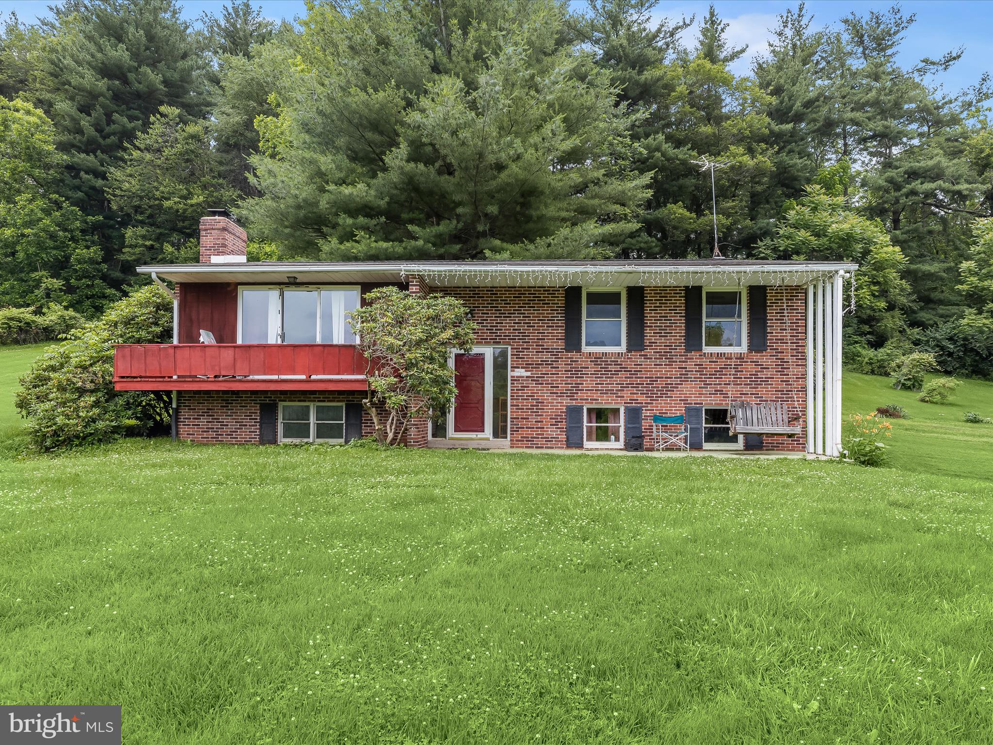 4704 Baughman Mill Road Manchester, MD 21102 - Photo 8 of 64 a front view of a house with a yard and garage