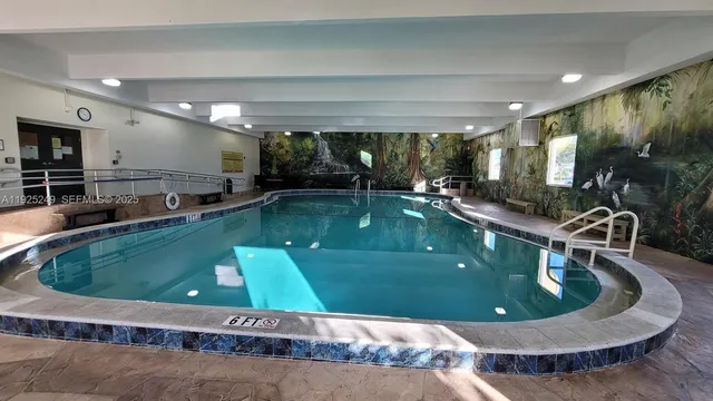 a kitchen with a large pool table and chairs