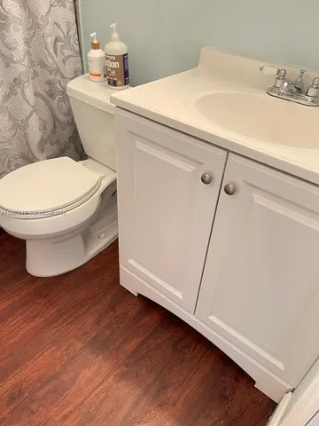a bathroom with a toilet and a sink