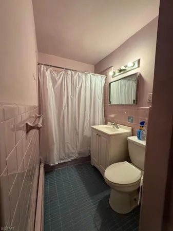 a bathroom with a toilet a sink and bathtub