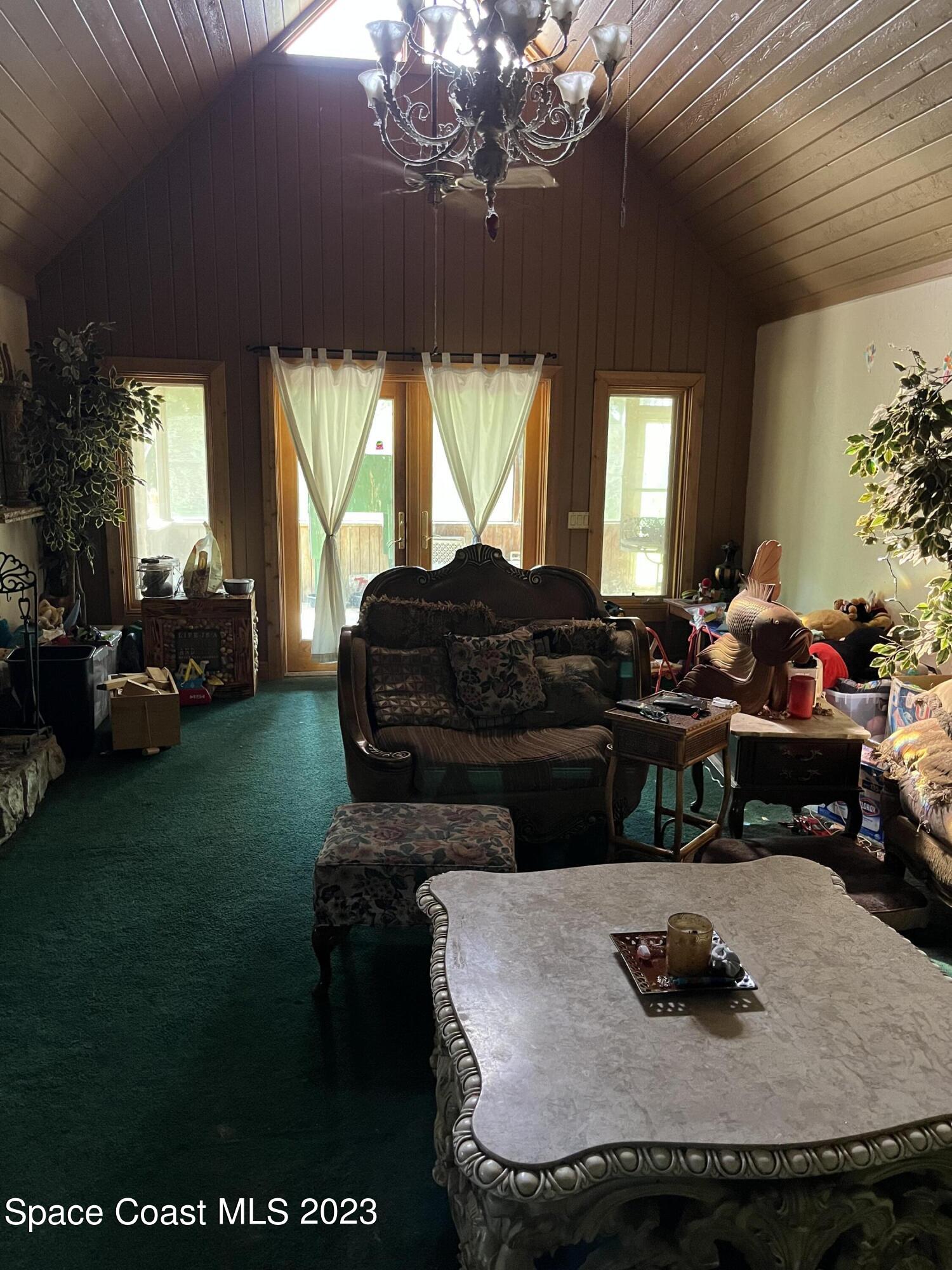 2265 Atz Road Malabar, FL 32950 - Photo 16 of 38 Family room with cathedral ceilings