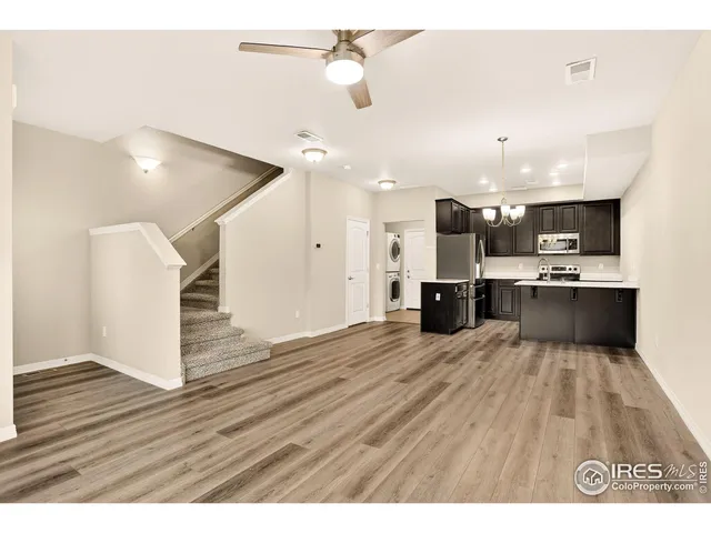 a view of kitchen with wooden floor